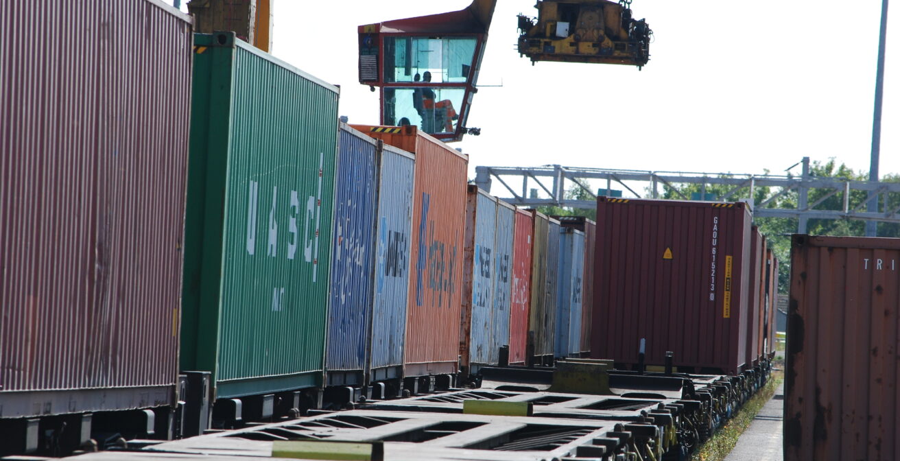 Rail freight wagons being loaded at a freight yard