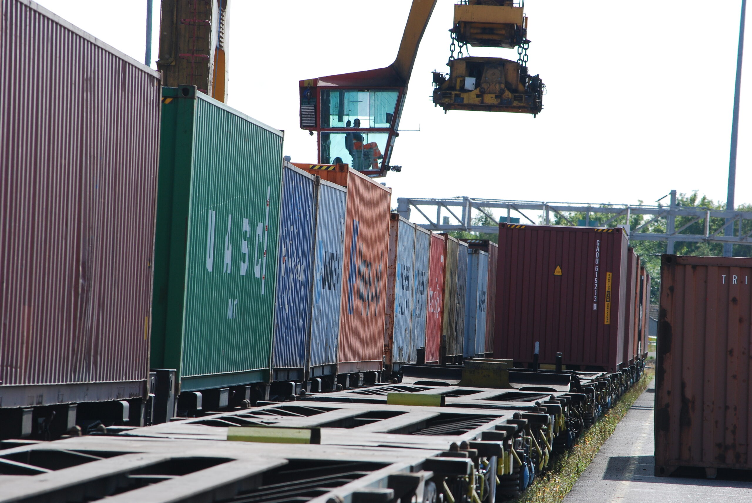 Rail freight wagons being loaded at a freight yard